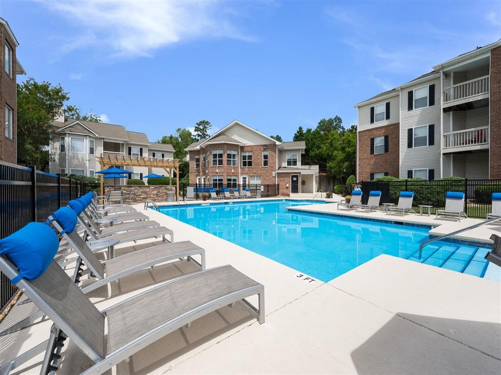 Sparkling resort-style swimming pool with sundeck and lounge chairs at Chace Lake Villas apartments in Birmingham, AL Sparkling resort-style swimming pool with sundeck and lounge chairs at Chace Lake Villas apartments in Birmingham, AL